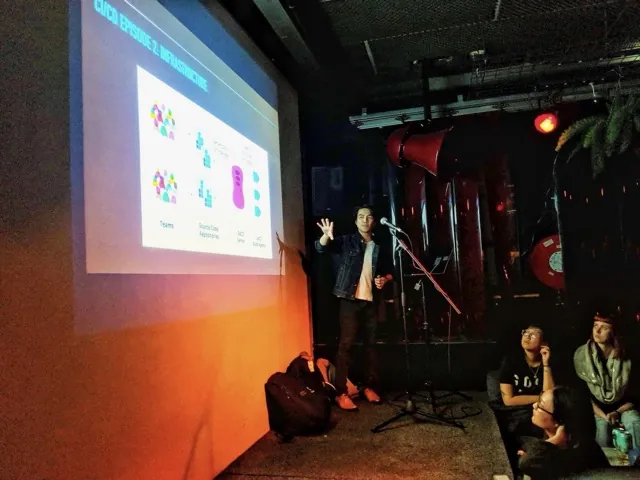 Michael presenting a talk on CI/CD infrastructure at a meetup